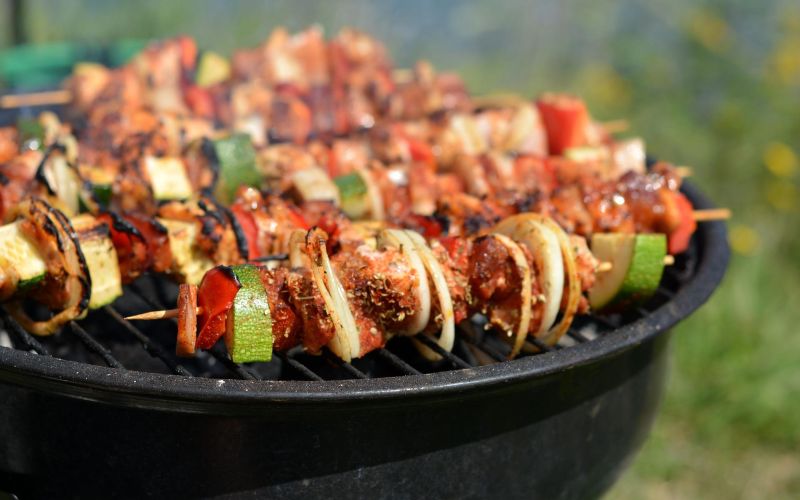 Meat and vegetable kebabs on grill