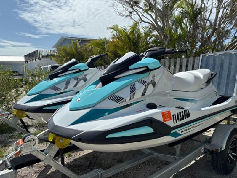 Two jet skis on a rental property trailer