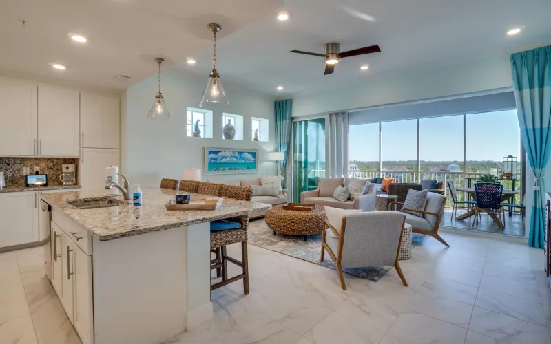 Bright bedroom with ocean view and aqua accents