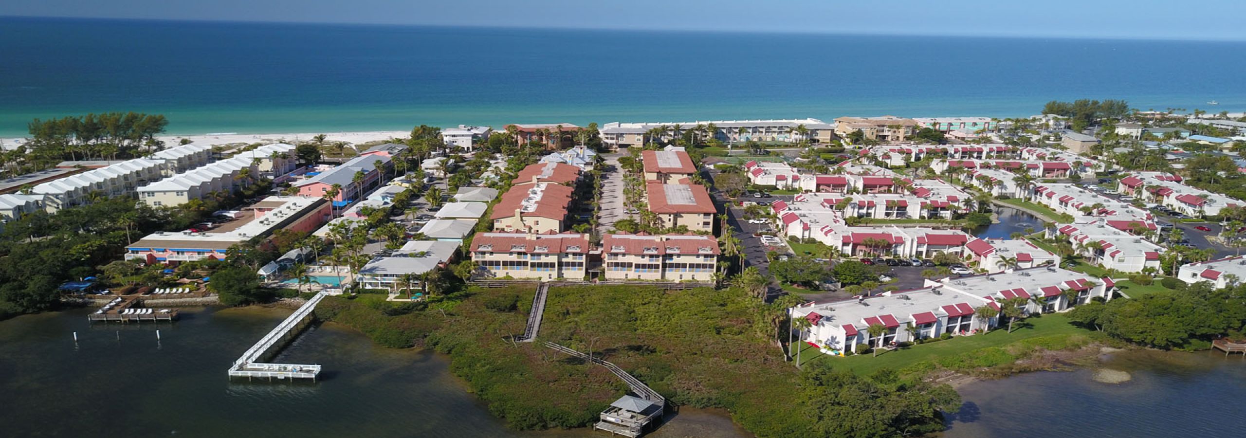 Aerial view of beachfront neighborhood with waterways