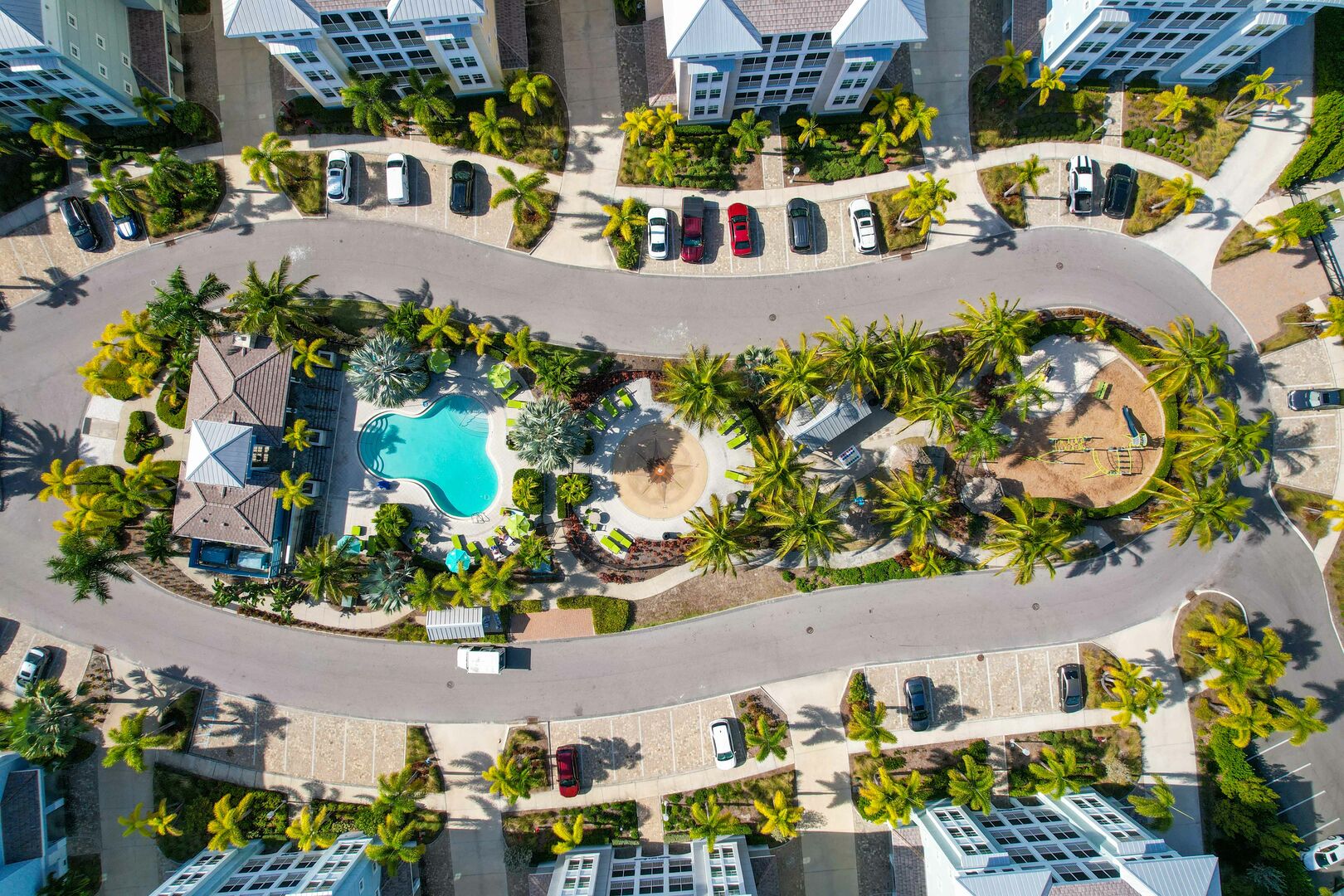 Aerial view of a sparkling pool centered in the Seabreeze vacation rentals in Florida