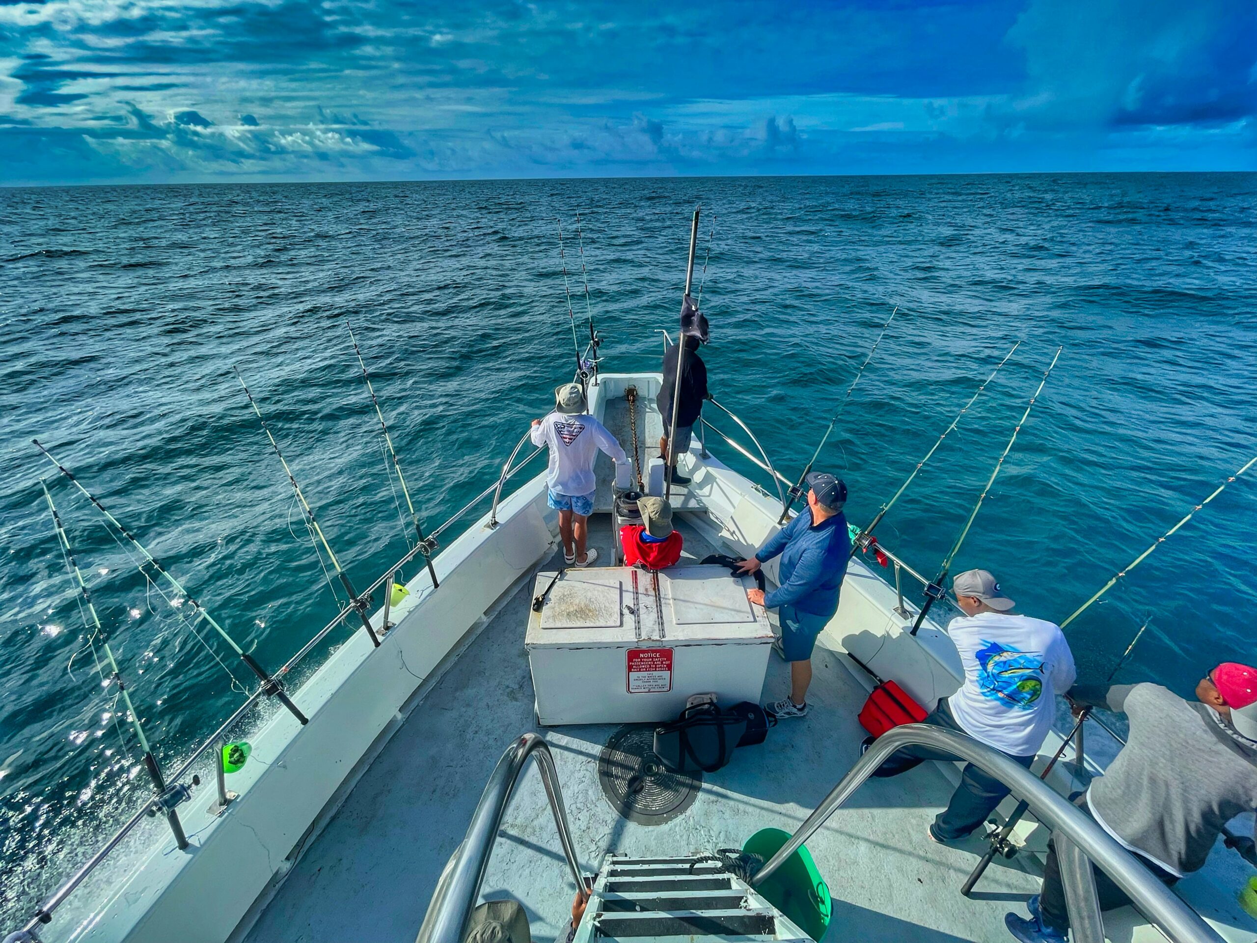 men fishing from boat