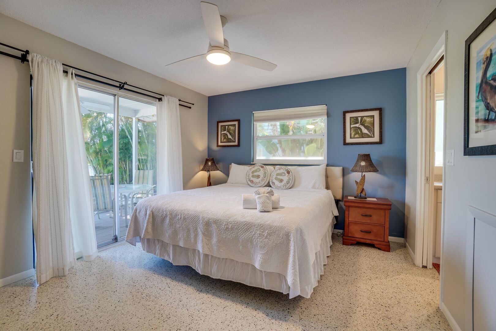 Serene bedroom with white bed and blue walls