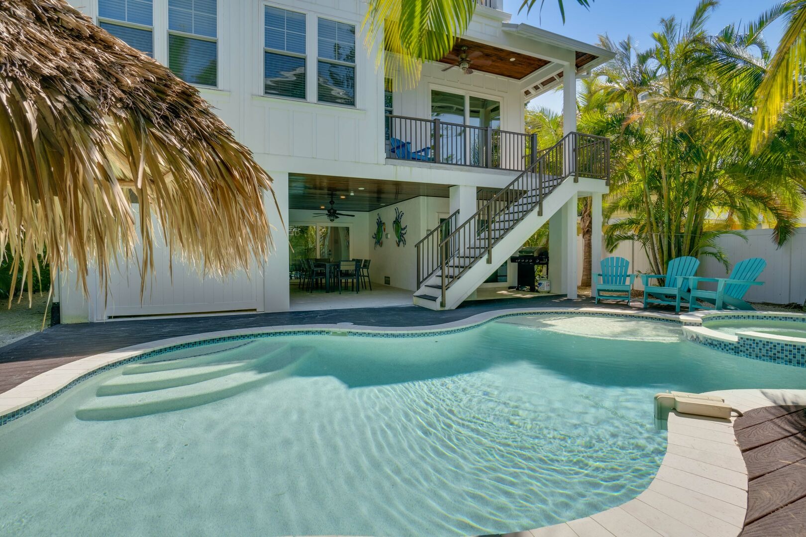 Vacation rental with pool and tropical landscaping