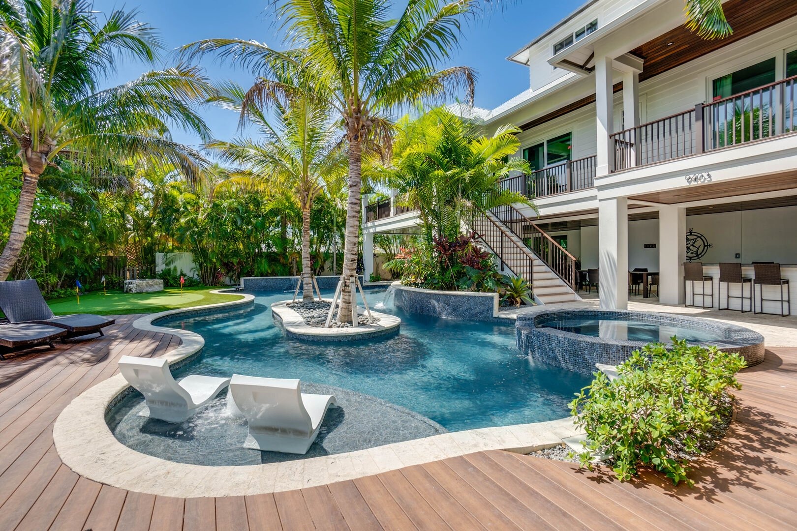 Luxury pool with waterfall feature and spa