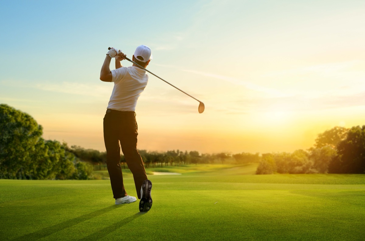 Golfer hit sweeping driver after hitting golf ball down the fair