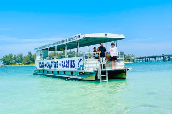 Fishing boat in shallow tropical turquoise water