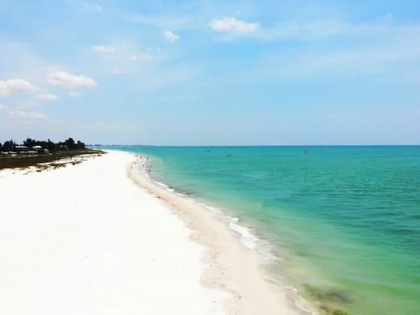 Pristine white sand beach meeting turquoise ocean