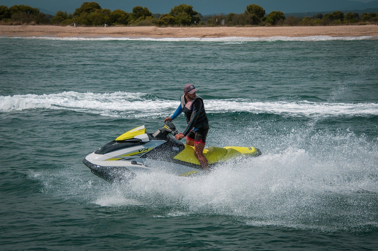 Person riding jet ski in ocean waves